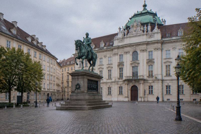 The bronze equestrian statue of Emperor Joseph II on Josefsplatz, with the Baroque facade of the former Court Library behind.