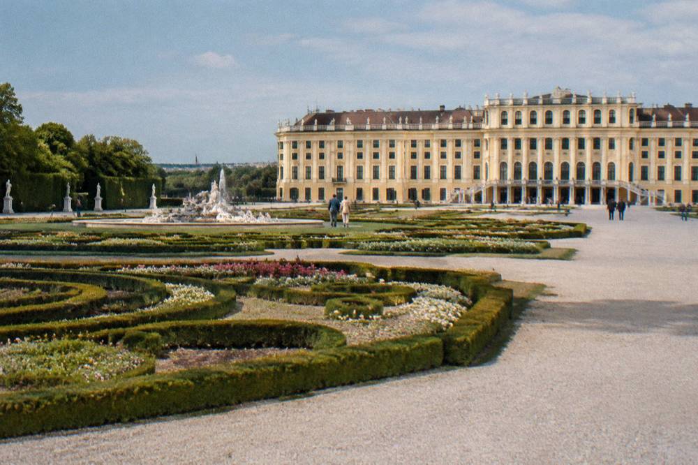 Formal parterre beds in front of the Schönbrunn palace's garden front with low clipped hedges and gravel