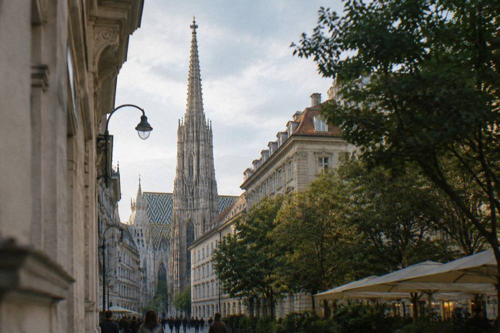 The cathedral's south tower rising over the roofline of Singerstrasse with the old town behind