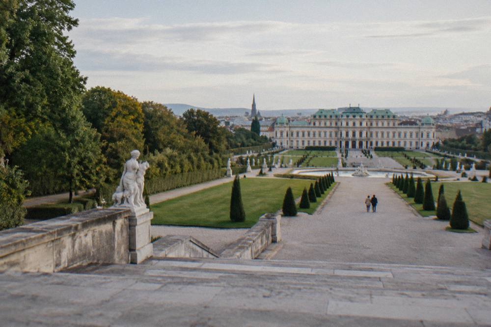 Stone steps and low terrace walls of the Belvedere garden descending between symmetrical lawns toward the Lower Belvedere